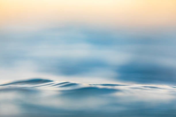 Silky smooth ocean surface at sunrise evoking calm, relaxation, and emotional flow in person-centered therapy